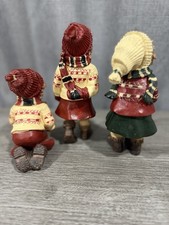 Vintage Three Christmas figurines of girls in winter outfits picture