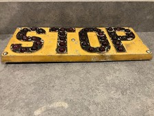 Antique Stop Sign with Red Cat Eye Glass Reflectors picture
