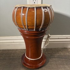 Vintage wooden djembe hand drum with natural skin head and rope tuning. picture