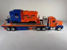 LIONEL TMT-18416, FLAT BED TRUCK w/NON OPERATING DIESEL LOCOMOTIVE, NIB picture