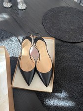 Beautiful pair of Christian Louboutin Sharka low-heel shoes in classic black. picture