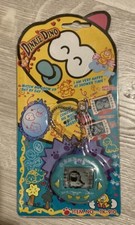 Dinkie Dino Electronic Virtual Pet RakuRaku Dinokun Green English Ver. Rare picture