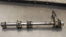1981 Honda 250S XL REAR AXLE W/ SPACERS AND BRAKE BRACKET P904.5 picture