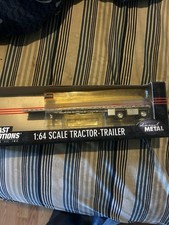 DCP 1/64 FLATBED TRAILER SPREAD AXLE picture