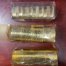 Brass napkin rings - 3 sets of 4, each with a different design / made in India  picture