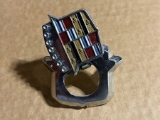 GM 9833483 Trunk Lock Flip Up Cover Emblem -- 1971-1976 Cadillac Eldorado -- NOS picture