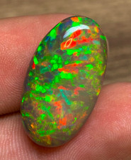 Black Ethiopian Opal 9.85 Carats Oval Cabochon having Rare Pattern Play of Color picture