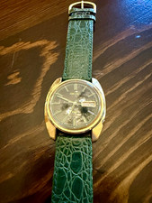Seiko DX Men's Automatic Day/Date Black Dial Gold Case Green Leather Strap picture