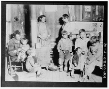 Photo:1900s Interior Family of Nine Cabin Homestead Children Portrait picture