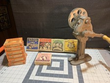 Vintage Wenzel Cast Iron 16 mm Film Rewind & 11 Movie Reels picture