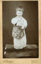 Cute boy dressed as Cardinal in religious attire antique cabinet photo Germany picture