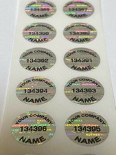100 CUSTOM PRINTED TAMPER EVIDENT SILVER HOLOGRAM LABELS .65 INCH ROUND picture