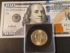 JUST RELEASED -$100 US Dollar with Trump's signature and $1 Trump coin.  In Hand picture
