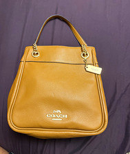 Caramel Colored/ Brown leather coach bag, brand new without tags. picture