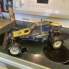 Kyosho Optima 4WD Electric 1:10 Off-Road RC Buggy Blue/Yellow picture