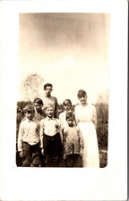 Postcard Real Photo RPPC Woman with a Group of Boys Outside picture