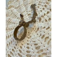 Vintage Victorian Revival Gold Tone Etched Mechanical Glove Clip Holder picture