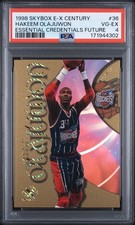 HAKEEM OLAJUWON 1998-99 SKYBOX E-X CENTURY ESSENTIAL CREDENTIALS 25/55 PSA 4 picture