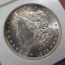 1902-O $1 NGC MS64. Pretty bronze/rose & blue rim accent toning. (1026044) picture