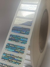 10,000 ROLL BRIGHT SILVER HOLOGRAM VOID SECURITY LABELS - 1.5 X .50 IN. picture