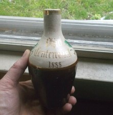 1888 DATED OHIO CENTENNIAL STONEWARE BOTTLE HAND PAINTED FLOWERS HANDLE BROKEN picture