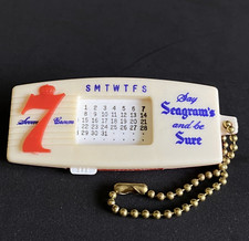 Seagrams 7 Seven Crown Whiskey Keychain Perpetual Calendar Novelty Gift USA Vtg picture
