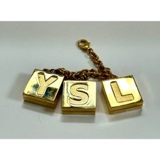 Vintage YSL Gold Purse Charm with 3 Mini Lipsticks – Rare Collector’s Edition picture