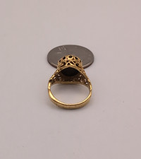 18kt HGE ring with a filigree design and a black onyx stone. picture
