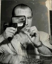 1958 Press Photo Ray Lyles Examines Rare Liberty Head Nickel - lry27011 picture