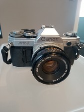 Canon AT-1 35mm Film SLR Camera with FD 50mm f1.8 Lens Silver Black Vintage picture
