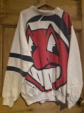 A vintage Cleveland Indians MLB sweatshirt featuring the old Chief Wahoo picture
