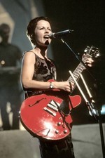 Singer Dolores O'Riordan is shown at a live concert appearance wit- Old Photo picture