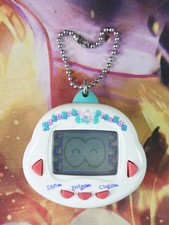 RakuRaku Dinokun Dinkie Dino 1997 Electronic Virtual Digital Tamagotchi Giga Pet picture