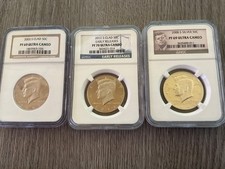 2005s clad pf69. 2012 s pf70 ultra. 2000s silver pf69 ultra. 3 coins graded picture