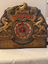 Vintage Seagrams Canadian Whiskey Electric Clock W/Rotating Whiskey Advertising picture