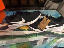 Nike Revolution 7 sneakers in a black and white colorway picture
