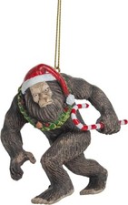 Bigfoot Wearing Santa Hat Walking with Candy Cane Sasquatch Christmas Ornament picture