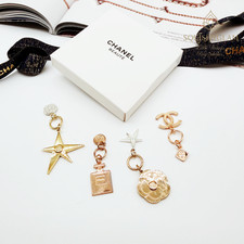Chanel Beaute VIP GWP Gold Metal Charm Set 4pc CC Star Camellia Bottle New Box picture