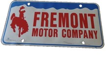 Vintage Freemont Motor Company  License Plate Cody Wyoming. picture