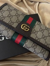 Gucci woman Wallet brown monogram gold logo Wallet picture