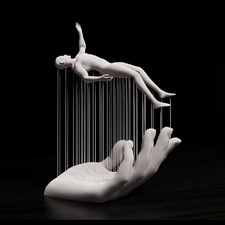 White Hand Holding Dangling Human Figure Sculpture, Freestanding Modern Decor picture