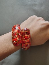 Vintage 1950s–60s red glitter confetti lucite bypass snake bracelet. picture